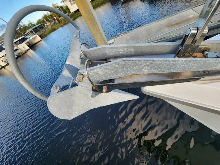 Soleyah Yacht Photos Pics Catalina 387 sailboat anchor detail, 2007 model, docked by calm waters.