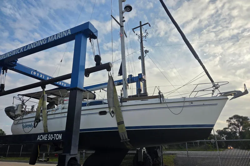Soleyah Yacht Photos Pics 2007 Catalina 387 sailboat at Brunswick Landing Marina, lifted by ACME 50-ton hoist.