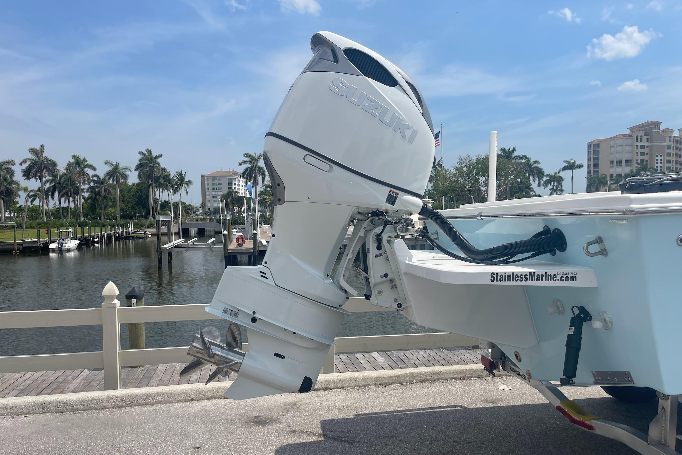 2026 C-Hawk 26 Center Console with Suzuki outboard motor at marina dock.