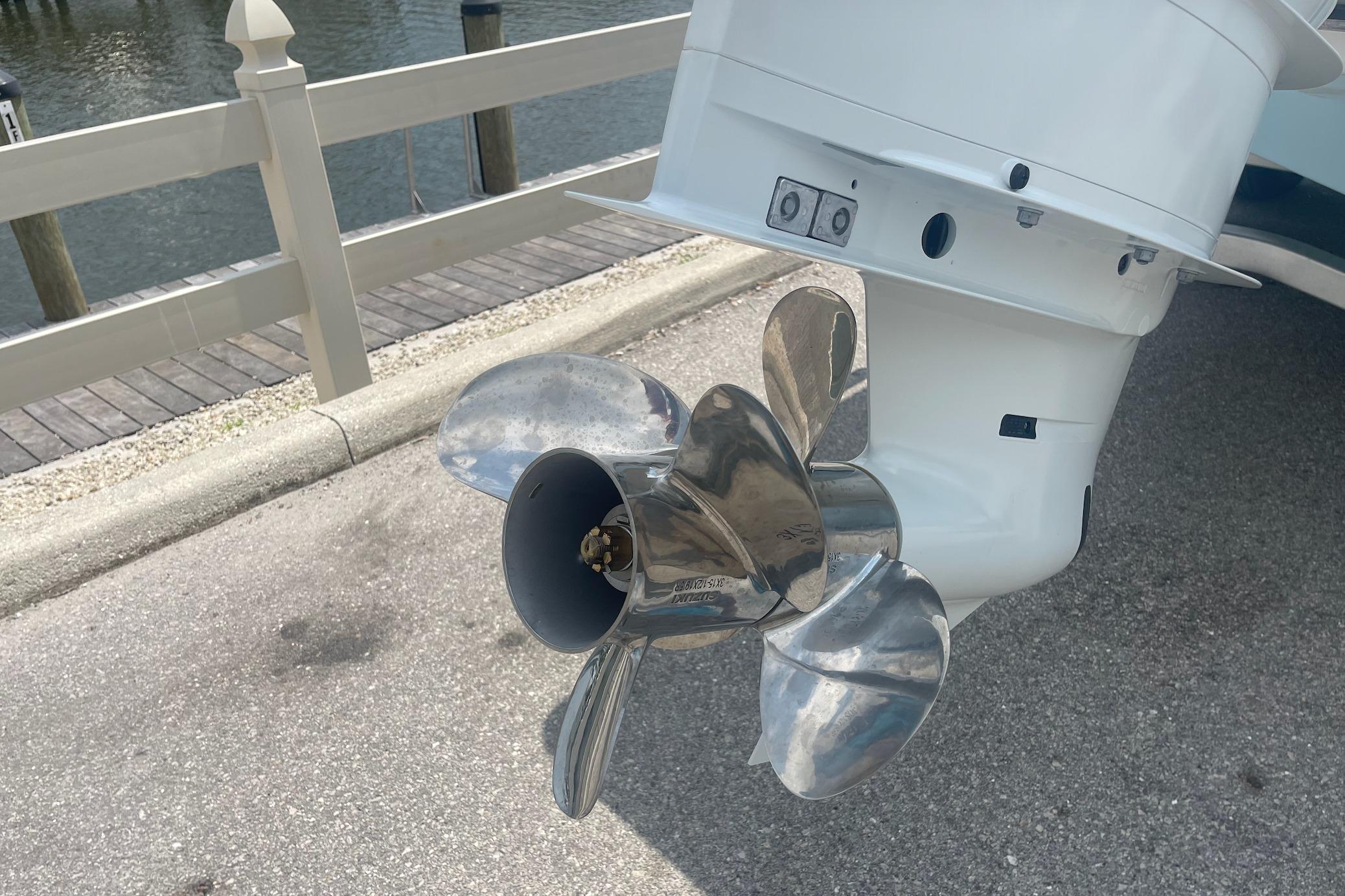2026 C-Hawk 26 Center Console boat propeller by the water.