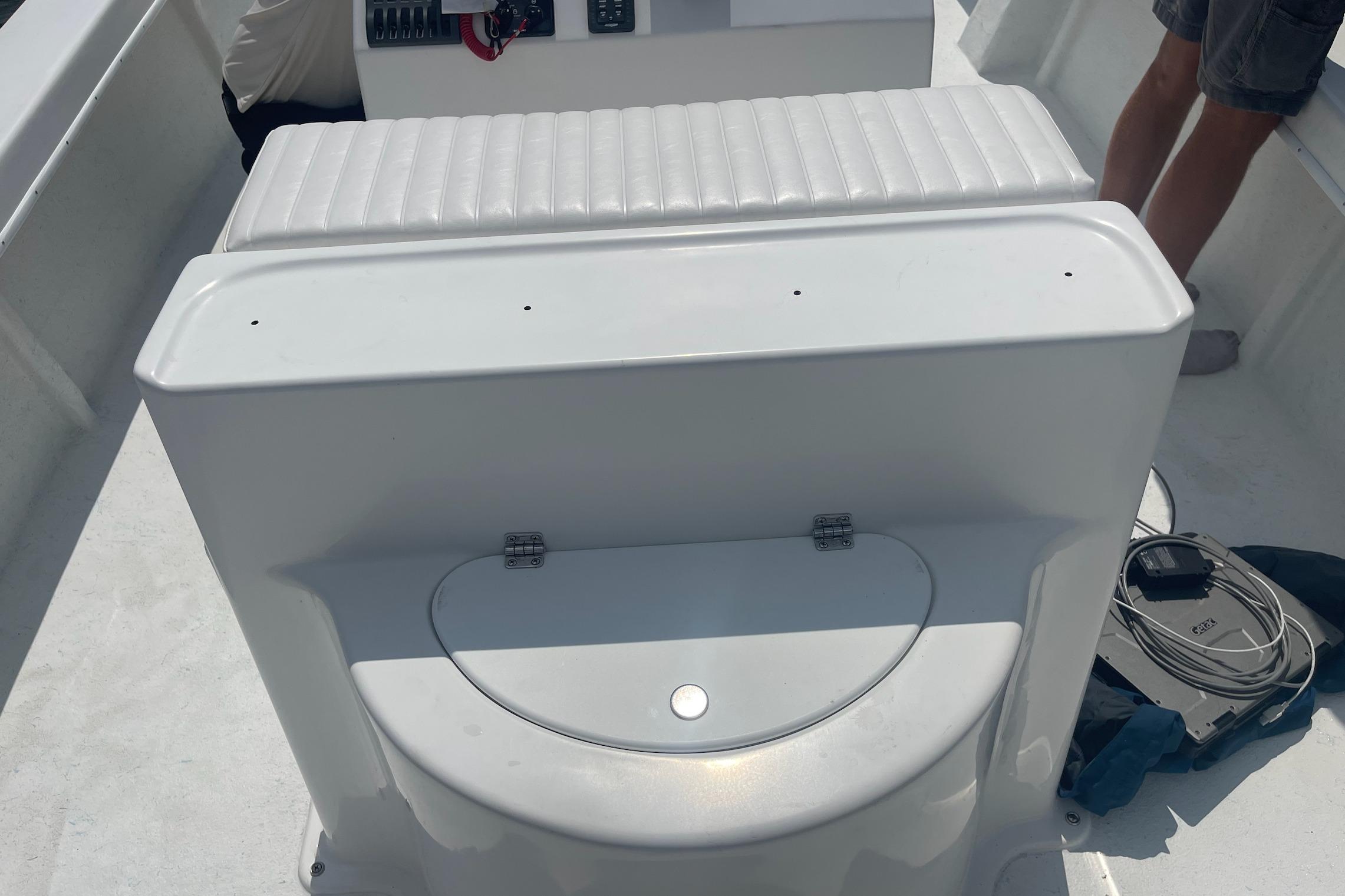 2026 C-Hawk 26 Center Console boat interior with seating and storage compartment.