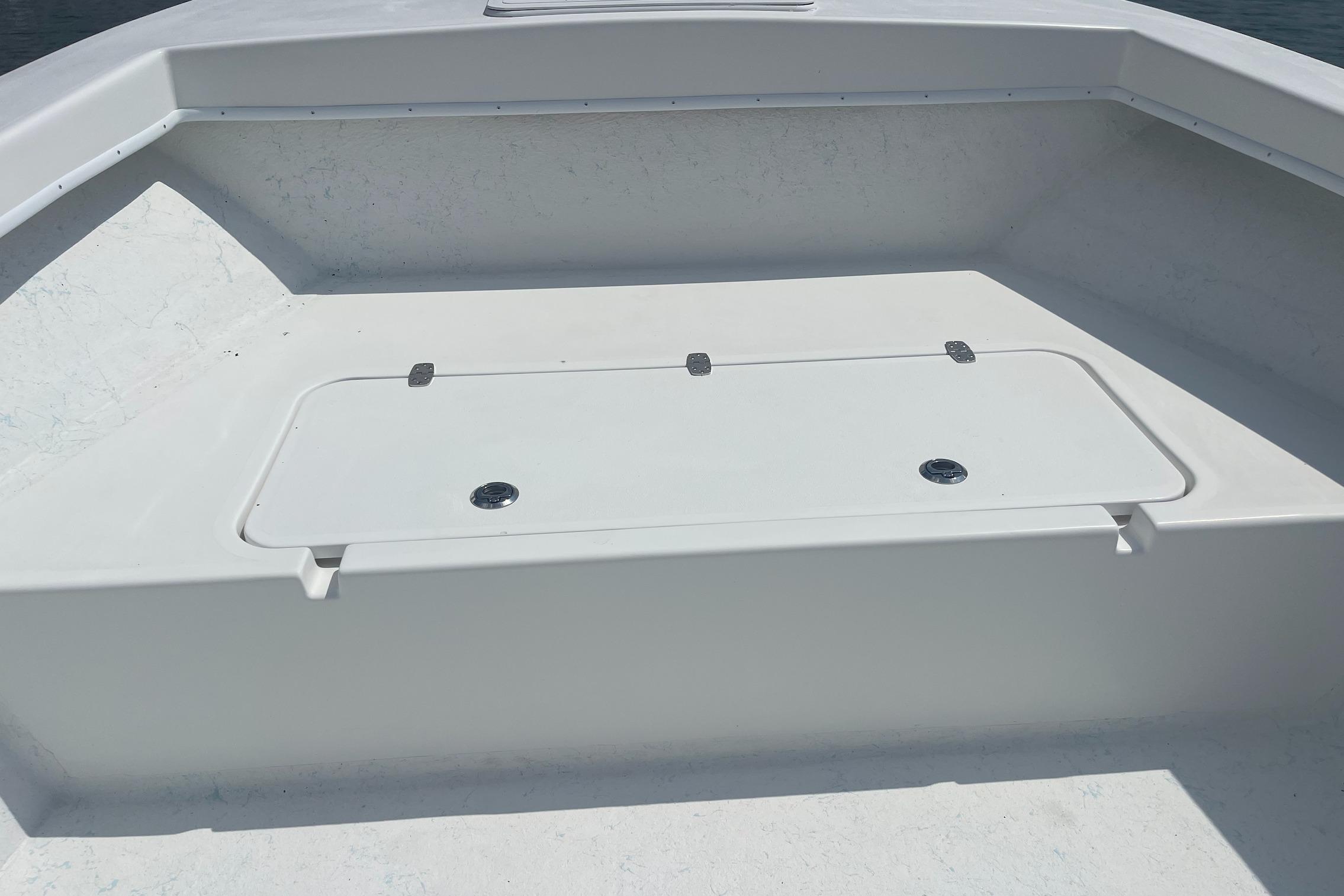 2026 C-Hawk 26 Center Console boat deck with storage compartment.
