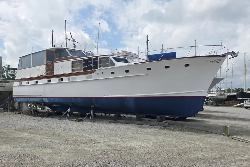 Windrush Yacht Photos Pics 1966 Trumpy 55 yacht on dry dock, showcasing classic design and elegant craftsmanship.