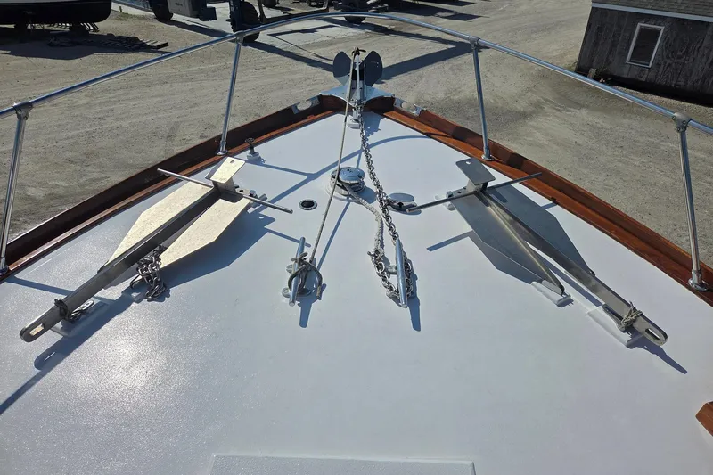 Windrush Yacht Photos Pics Bow of 1966 Trumpy 55 yacht with anchors and chains on deck.