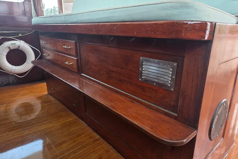 Windrush Yacht Photos Pics Vintage 1966 Trumpy 55 yacht interior with polished wood and life preserver.