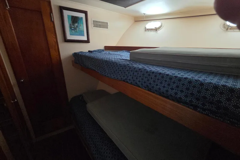 Windrush Yacht Photos Pics Bunk beds in a 1966 Trumpy 55 yacht cabin with nautical decor.