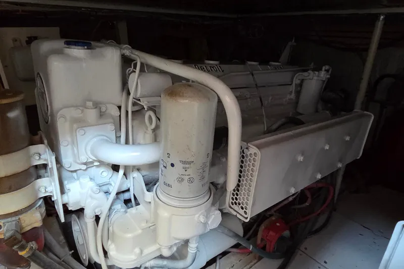 Windrush Yacht Photos Pics Engine of a 1966 Trumpy 55 boat, showcasing mechanical components and filters.