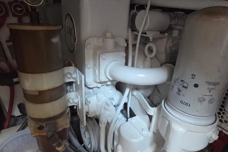 Windrush Yacht Photos Pics Engine components of a 1966 Trumpy 55 boat, featuring pipes and filters.