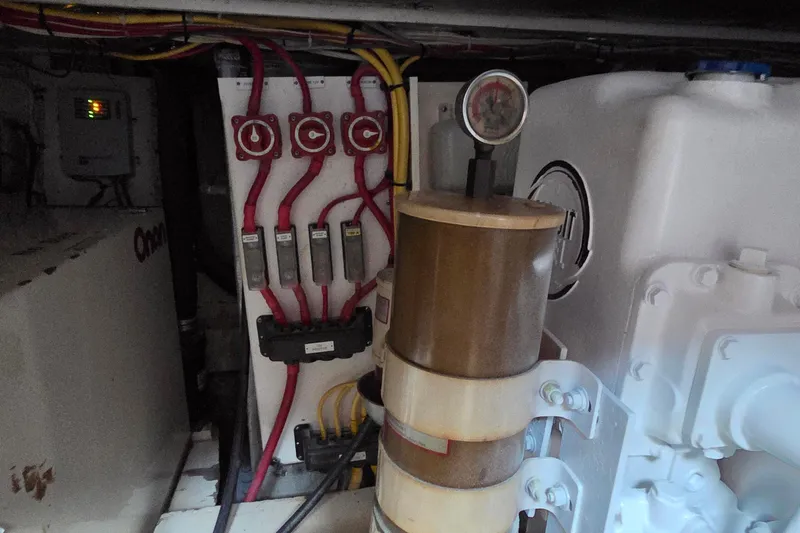 Windrush Yacht Photos Pics Engine room of a 1966 Trumpy 55 yacht, featuring electrical components and gauges.