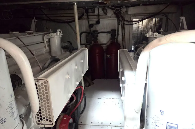 Windrush Yacht Photos Pics Engine room of a 1966 Trumpy 55 yacht, featuring machinery and equipment.