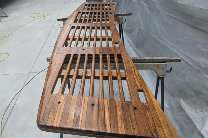 Windrush Yacht Photos Pics Restored wooden deck of a 1966 Trumpy 55 yacht, showcasing intricate craftsmanship.