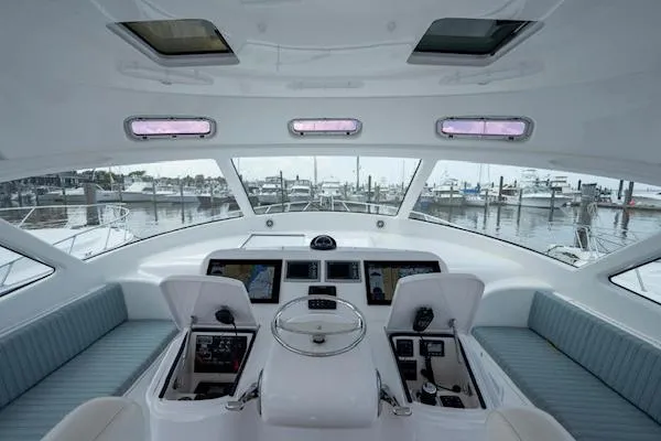 Drop&rsquo;em Yacht Photos Pics Interior helm of 2012 Viking 42 Open yacht with marina view.