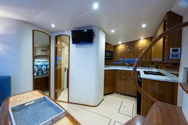 Drop&rsquo;em Yacht Photos Pics Interior of 2012 Viking 42 Open yacht with modern kitchen and cozy bedroom.
