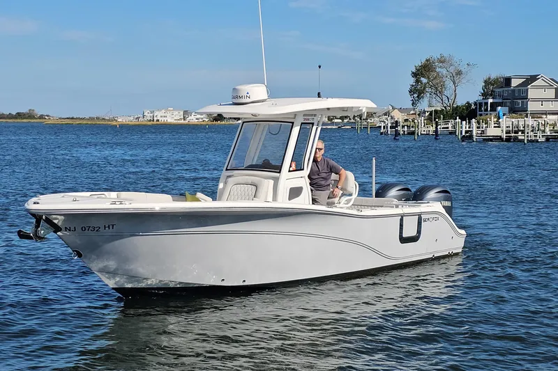  Yacht Photos Pics 2024 Sea Fox 268 Commander boat on water, featuring dual engines and sleek design.