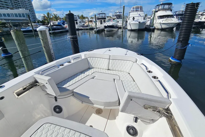  Yacht Photos Pics 2024 Sea Fox 268 Commander boat interior with cushioned seating at marina.