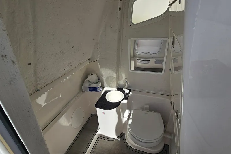  Yacht Photos Pics 2024 Sea Fox 268 Commander boat interior bathroom with toilet and sink.