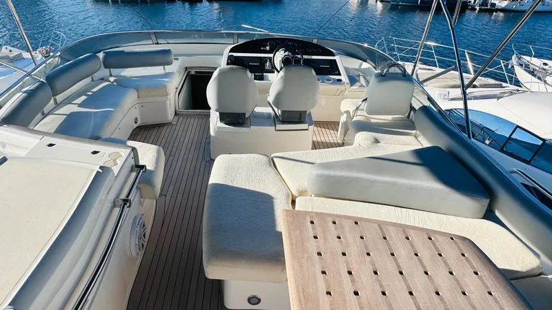  Yacht Photos Pics Luxurious 2004 Fairline Squadron 74 yacht interior with spacious seating and helm.