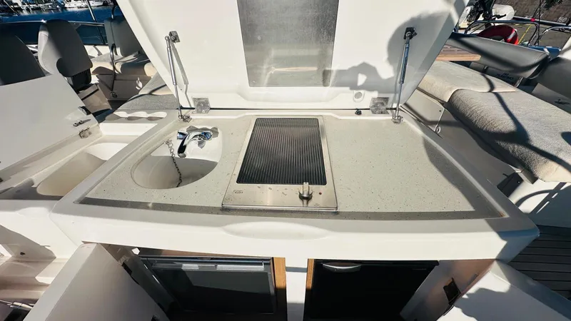  Yacht Photos Pics Outdoor kitchen on 2004 Fairline Squadron 74 yacht with sink and grill.