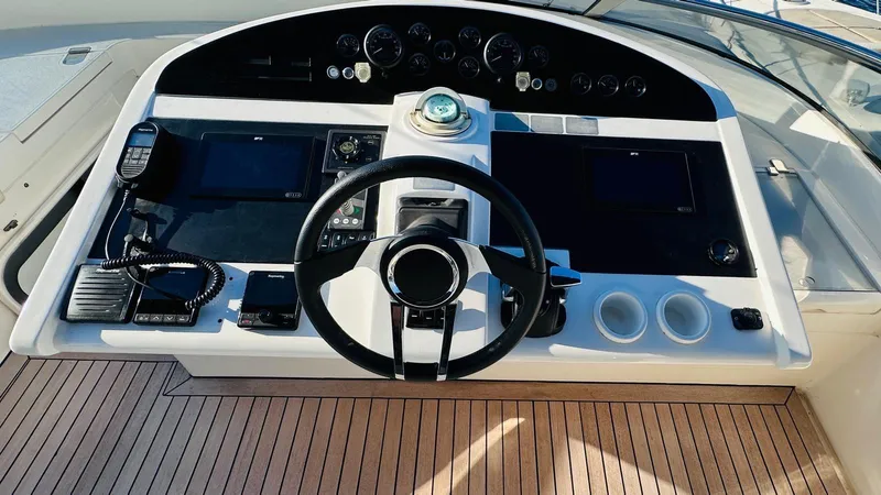  Yacht Photos Pics Control panel of a 2004 Fairline Squadron 74 yacht with wooden deck.