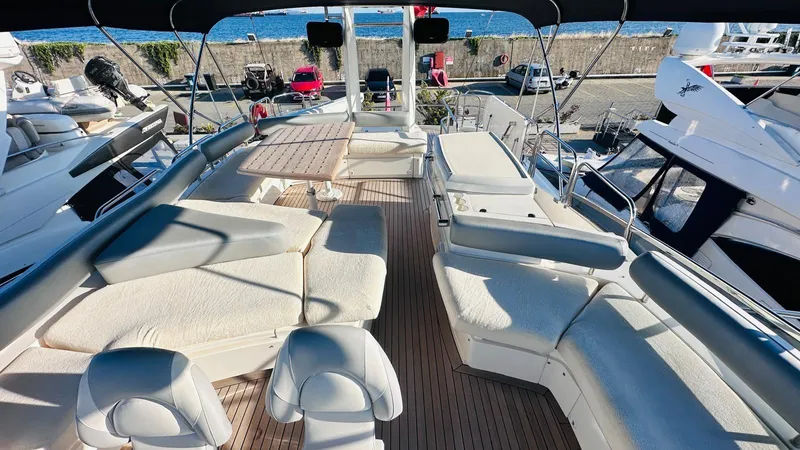  Yacht Photos Pics Luxurious 2004 Fairline Squadron 74 yacht deck with seating and ocean view.