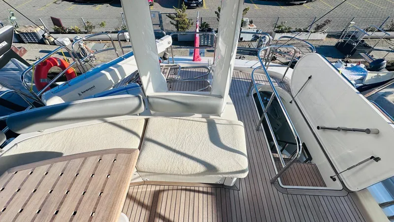  Yacht Photos Pics 2004 Fairline Squadron 74 yacht deck with seating and railing, showcasing luxury marine design.