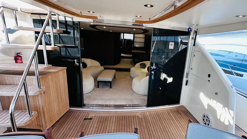  Yacht Photos Pics Luxurious 2004 Fairline Squadron 74 yacht interior with elegant seating and wooden flooring.