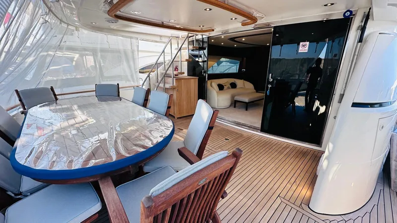  Yacht Photos Pics Luxurious 2004 Fairline Squadron 74 yacht interior with elegant dining area and modern seating.