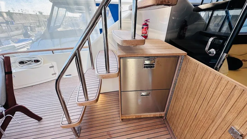  Yacht Photos Pics Stainless steel drawers and stairs on 2004 Fairline Squadron 74 yacht deck.
