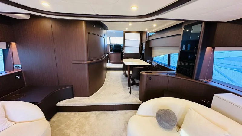  Yacht Photos Pics Luxurious interior of 2004 Fairline Squadron 74 yacht with elegant wood finishes.