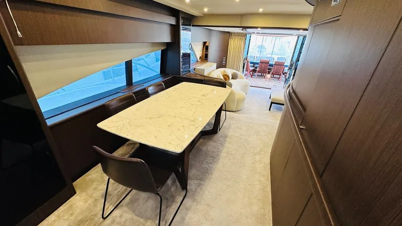  Yacht Photos Pics Luxurious interior of 2004 Fairline Squadron 74 yacht with elegant dining area.