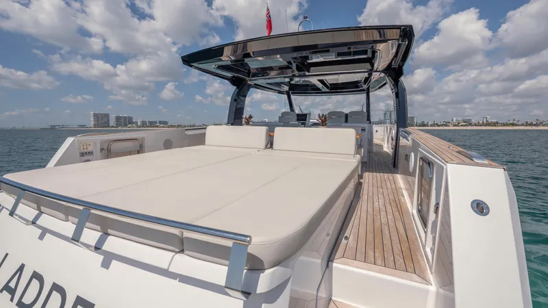 Ladder Yacht Photos Pics Luxury yacht Fjord 53XL 2023 on open sea under sunny skies.