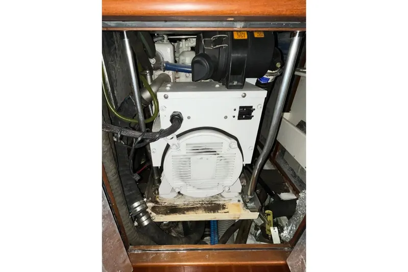  Yacht Photos Pics Engine compartment of a 2004 Hylas 49 sailboat, showcasing mechanical components.