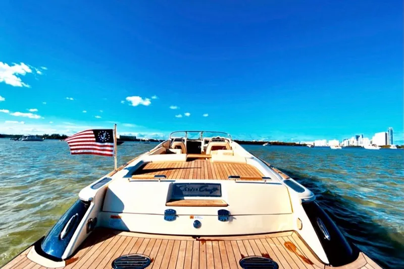  Yacht Photos Pics 2019 Chris-Craft Corsair 30 yacht cruising on open water under clear blue skies.
