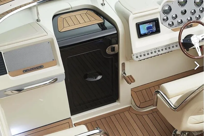  Yacht Photos Pics 2019 Chris-Craft Corsair 30 cockpit with elegant dashboard and wooden accents.