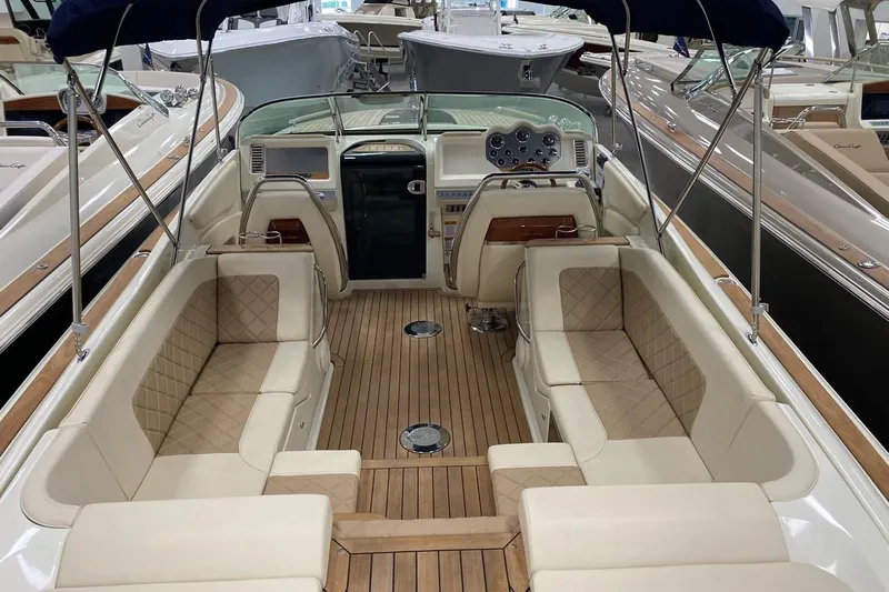  Yacht Photos Pics 2019 Chris-Craft Corsair 30 boat interior with luxurious seating and wooden deck.