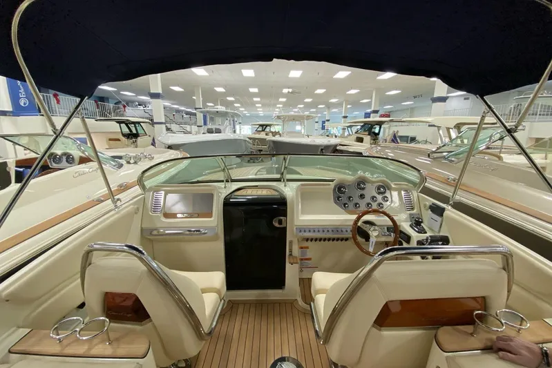 Yacht Photos Pics 2019 Chris-Craft Corsair 30 boat interior with elegant dashboard and seating.