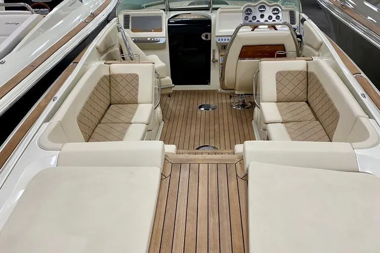  Yacht Photos Pics 2019 Chris-Craft Corsair 30 interior with luxurious seating and elegant wood finish.