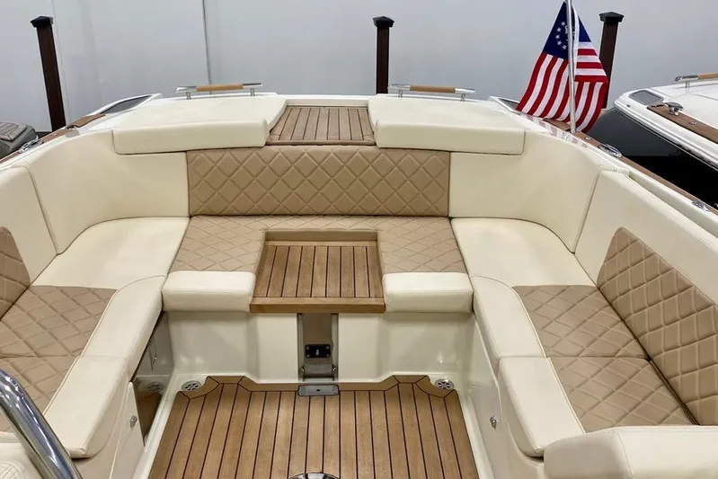  Yacht Photos Pics 2019 Chris-Craft Corsair 30 boat interior with elegant seating and American flag.