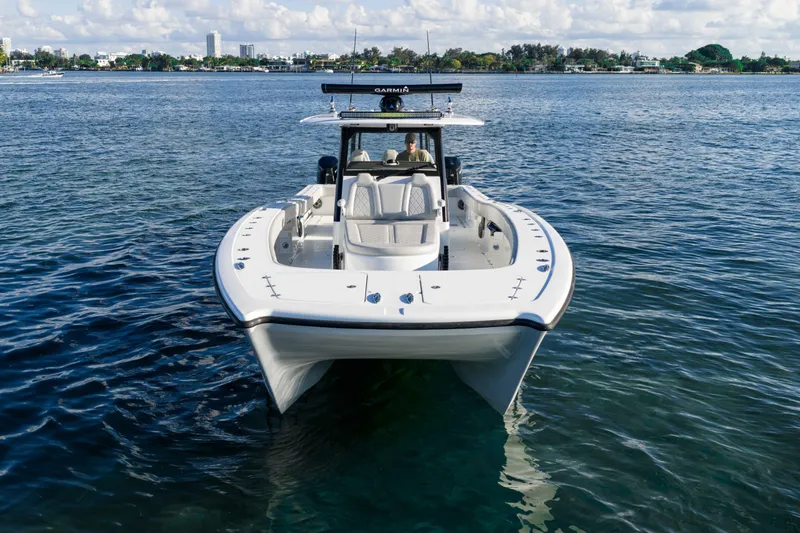 Red White And Booze Yacht Photos Pics 2022 Freeman 43 boat on calm water, showcasing sleek design and modern features.