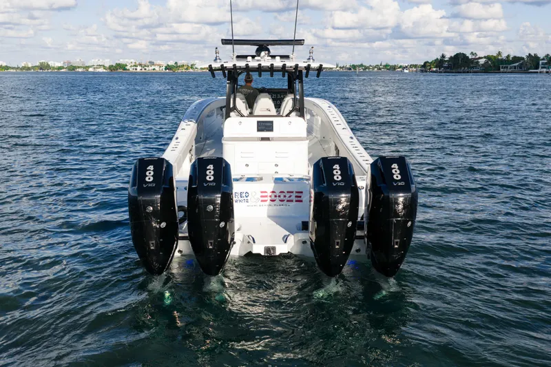 Red White And Booze Yacht Photos Pics 2022 Freeman 43 boat with four powerful 400 V10 engines on open water.