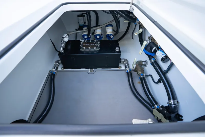 Red White And Booze Yacht Photos Pics Freeman 43 boat engine compartment, 2022 model, showcasing hoses and components.