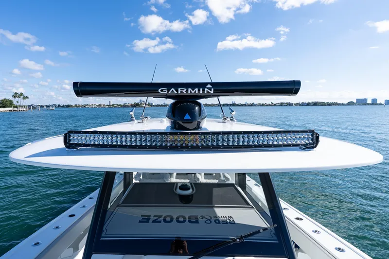 Red White And Booze Yacht Photos Pics 2022 Freeman 43 boat with Garmin radar on open water under blue sky.