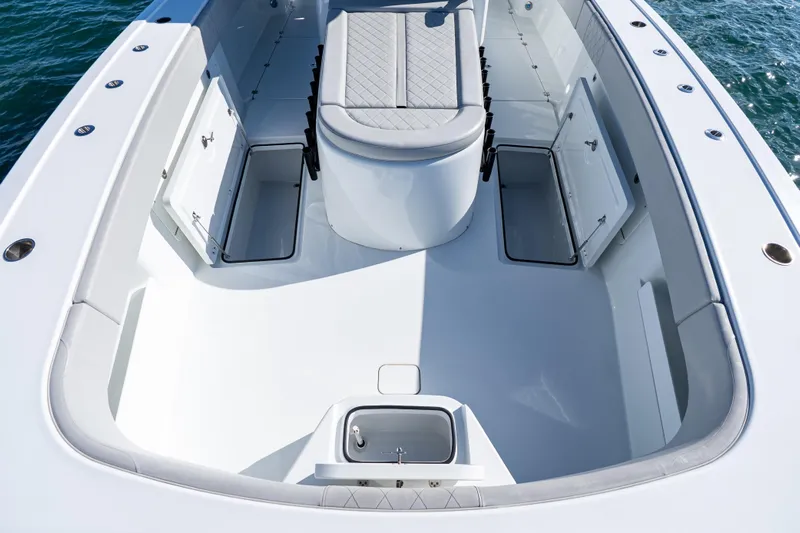 Red White And Booze Yacht Photos Pics 2022 Freeman 43 boat interior with open storage compartments and cushioned seating.