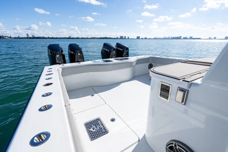 Red White And Booze Yacht Photos Pics 2022 Freeman 43 boat deck with four Mercury outboard engines on a sunny day.