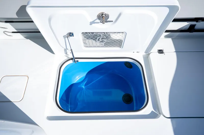 Red White And Booze Yacht Photos Pics Open hatch on 2022 Freeman 43 boat, revealing blue interior compartment.