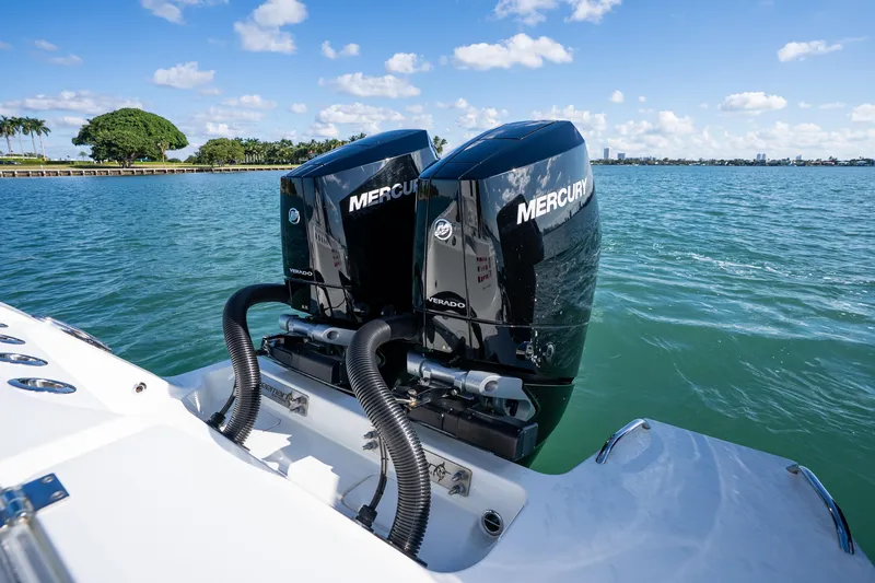 Red White And Booze Yacht Photos Pics Freeman 43 boat with dual Mercury Verado engines on a sunny day, 2022 model.