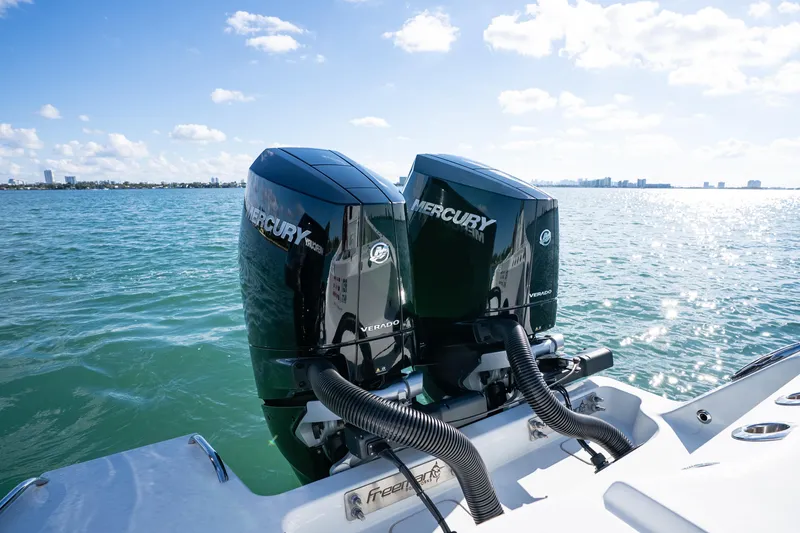 Red White And Booze Yacht Photos Pics Twin Mercury Verado engines on a 2022 Freeman 43 boat, cruising on a sunny day.