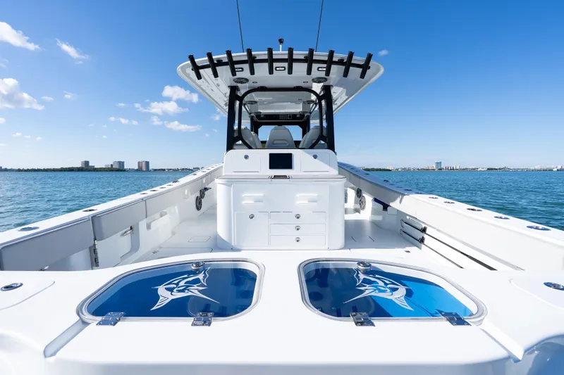 Red White And Booze Yacht Photos Pics 2022 Freeman 43 boat interior with sleek design on open water under clear blue sky.