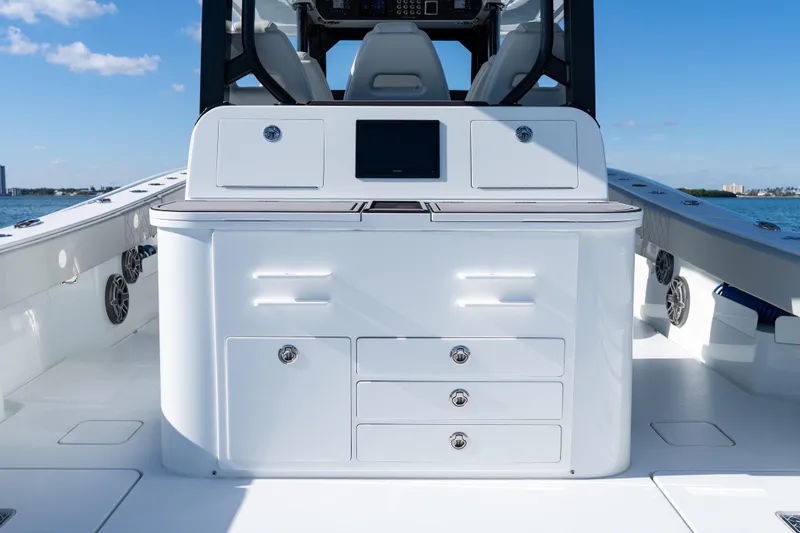 Red White And Booze Yacht Photos Pics 2022 Freeman 43 boat interior with sleek white cabinetry and modern design.