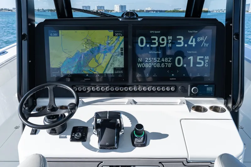 Red White And Booze Yacht Photos Pics Dashboard of a 2022 Freeman 43 boat with navigation and performance displays.